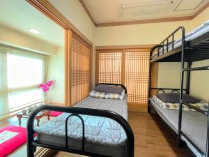 Postel nebo postele na pokoji v ubytování Cocoa Guesthouse