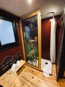 a bathroom with a shower and a window at Tiny House Bigge im PIER9 Tiny House Hotel in Hamm +9 photos