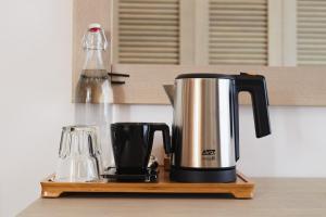 a coffeemaker sitting on a counter with a coffee maker at AmstelSki in Bukovel