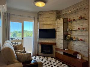 O zonă de relaxare la Apartamentos Solar da Colina CENTRO by Achei Gramado