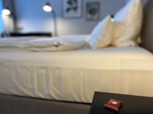 Postel nebo postele na pokoji v ubytování Hotel Ambiente