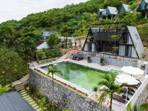 an aerial view of a house with a swimming pool at Les Bois BaVi by HOLO Serviced HomeStay in Hanoi