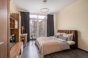 Ένα ή περισσότερα κρεβάτια σε δωμάτιο στο Grizinkalns residence with free parking