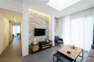 A television and/or entertainment centre at Acquarella Resort Suite