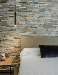 A bed or beds in a room at Acquarella Resort Suite