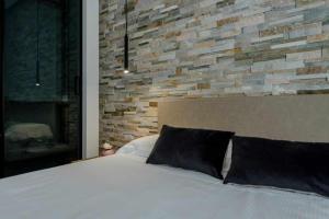 A bed or beds in a room at Acquarella Resort Suite