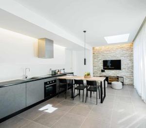 A kitchen or kitchenette at Acquarella Resort Suite