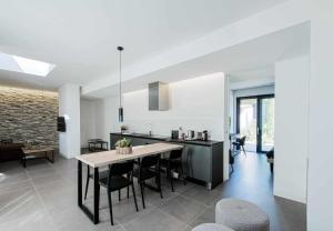 A kitchen or kitchenette at Acquarella Resort Suite