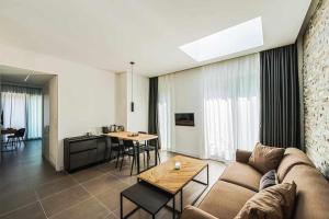 A television and/or entertainment centre at Acquarella Resort Suite