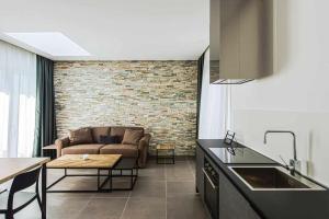 A kitchen or kitchenette at Acquarella Resort Suite