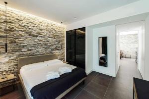 A bed or beds in a room at Acquarella Resort Suite