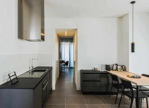 A kitchen or kitchenette at Acquarella Resort Suite