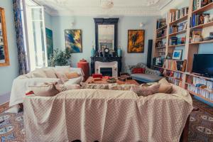 a living room with two couches and a fireplace at B&B en Provence- Villa Saint Marc in Forcalquier