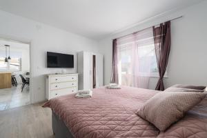 Postel nebo postele na pokoji v ubytování Villa Jolanda
