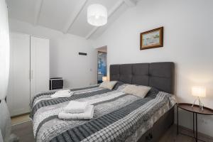 Postel nebo postele na pokoji v ubytování Villa Jolanda