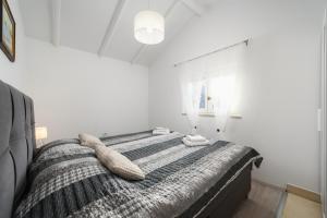 Postel nebo postele na pokoji v ubytování Villa Jolanda + 27 fotografií