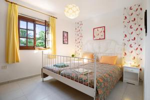 A bed or beds in a room at Casa Drago, Belleza y Tranquilidad