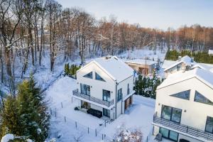 an aerial view of a house in the snow at Apartament Nad Strumykiem z ogródkiem - Dream Apart in Ustroń