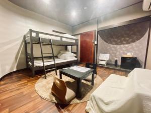 Postel nebo postele na pokoji v ubytování Hostel SAMURISE KURA