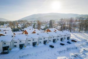 an aerial view of a snow covered town at Apartament Pod Czantorią z tarasem - Dream Apart in Ustroń