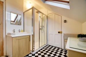 a bathroom with a sink and a shower and a toilet at Spacious Victorian Townhouse near HCC with off street parking in Harrogate +27 photos