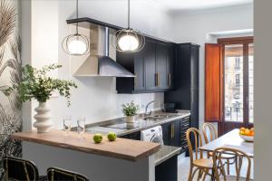 Kuchyň nebo kuchyňský kout v ubytování Hernando Colón Suite Apartments + 8 fotografií