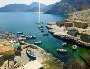 a group of boats in a body of water at Residence vip in Nador