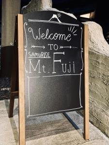 a chalkboard sign that says welcome toennamitemt full at SAMURISE Mt. Fuji in Fujikawaguchiko