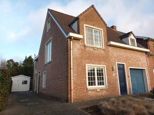a brick house with a driveway at Kanaalzicht21 in Hasselt