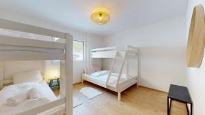 Postel nebo postele na pokoji v ubytování Sublime modern family apartment of 2 bedrooms