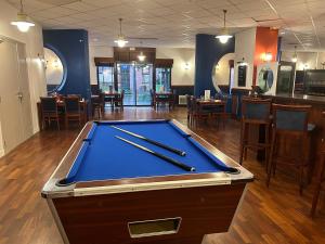 a pool table in the middle of a restaurant at B&B HOTEL Rouen Centre in Rouen