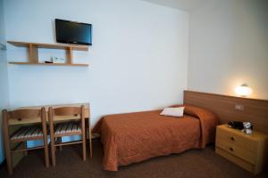 Letto o letti in una camera di Hotel Rio