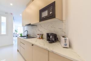 Kuchnia lub aneks kuchenny w obiekcie Apartamento Embajadores VI