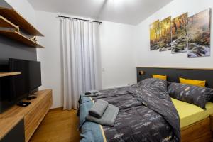 Apartman Šišarka Divčibare房間的床