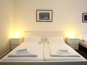 A bed or beds in a room at Flatprovider Comfort Eduard Apartment - contactless check in