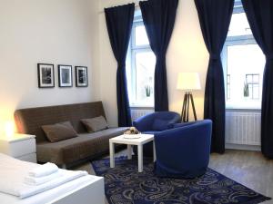 A seating area at Flatprovider Comfort Eduard Apartment - contactless check in