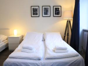 A bed or beds in a room at Flatprovider Comfort Eduard Apartment - contactless check in