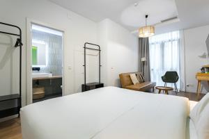 Łóżko lub łóżka w pokoju w obiekcie Vallecas Suites by Olala Homes