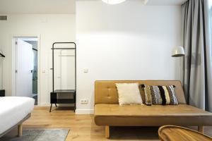 Łóżko lub łóżka w pokoju w obiekcie Vallecas Suites by Olala Homes