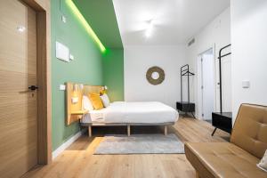 Łóżko lub łóżka w pokoju w obiekcie Vallecas Suites by Olala Homes