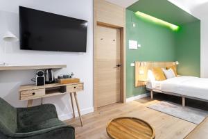 Łóżko lub łóżka w pokoju w obiekcie Vallecas Suites by Olala Homes