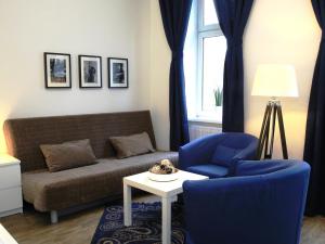 A seating area at Flatprovider Comfort Eduard Apartment - contactless check in