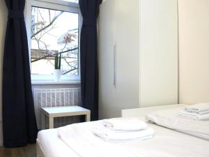 A bed or beds in a room at Flatprovider Comfort Eduard Apartment - contactless check in