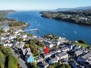an aerial view of a small town next to a river at Pass the Keys Comfortable Stone Built Cottage in Menai Bridge in Menai Bridge