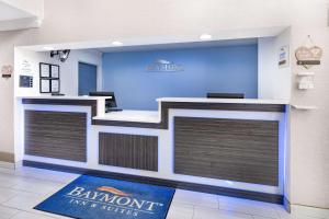 a front desk of a bank with two garage doors at Baymont by Wyndham Gurnee in Gurnee