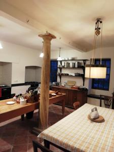 a kitchen with a table and a dining room at Summergrove House in Mountmellick