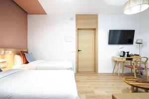 Łóżko lub łóżka w pokoju w obiekcie Vallecas Suites by Olala Homes