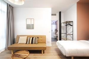 Łóżko lub łóżka w pokoju w obiekcie Vallecas Suites by Olala Homes