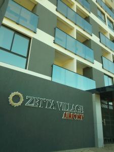 a sign for the zetter village entrance to a building at Hermoso Monoambiente ZV210, Edif Zetta Village Airport in Colonia Mariano Roque Alonso