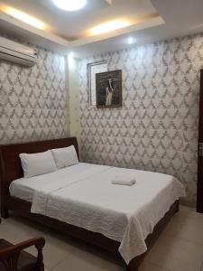 Postel nebo postele na pokoji v ubytování Trung hoa HOTEL